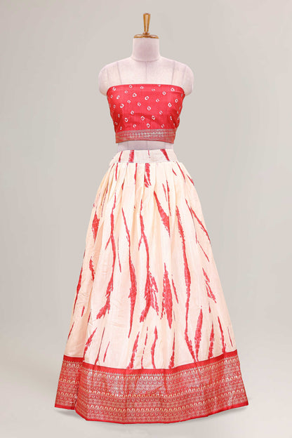 Cream dola silk bandhani designer lehenga with contrast blouse and dhavani