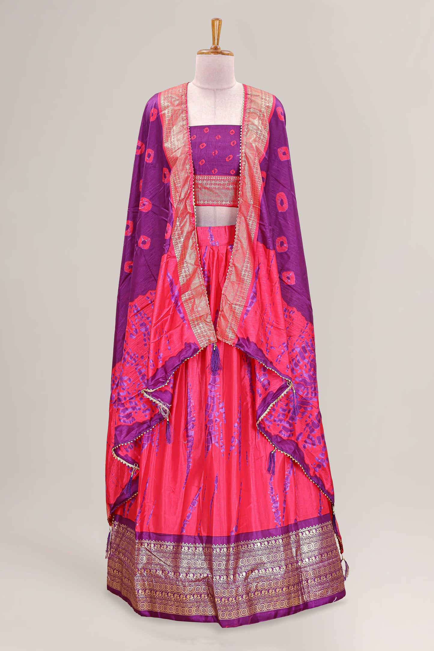 Pink dola silk bandhani designer lehenga with contrast blouse and dhavani