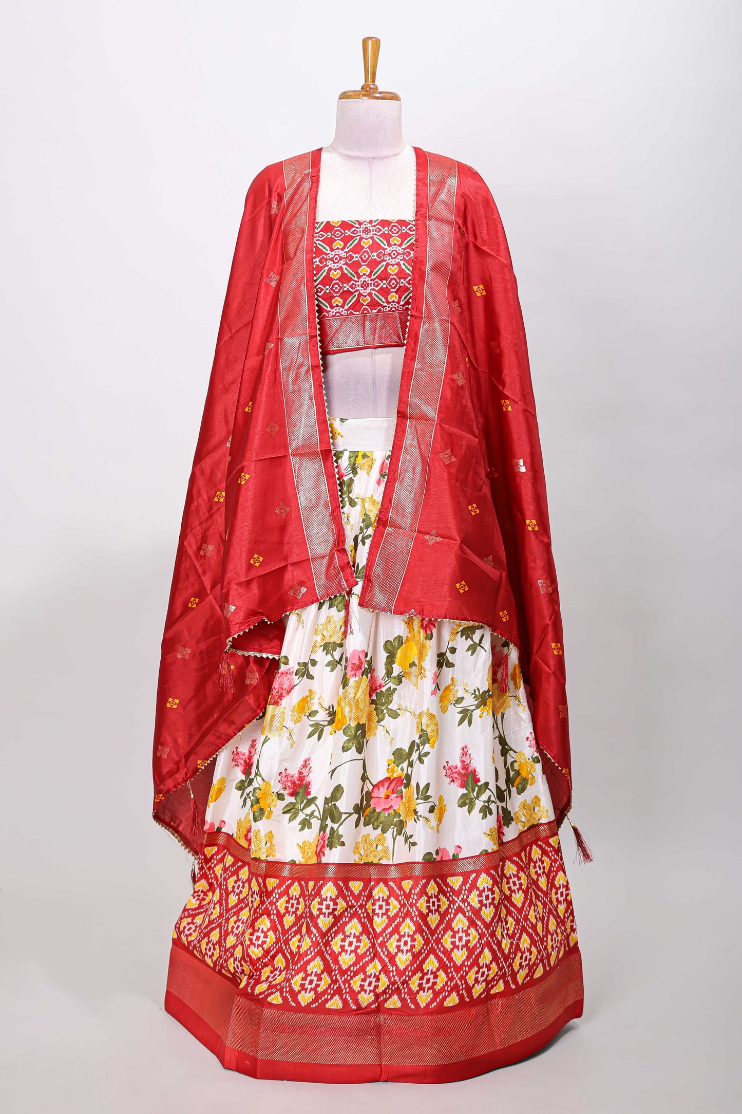 White dola silk floral lehenga with maroon pochampalli border and floral butta dhavani