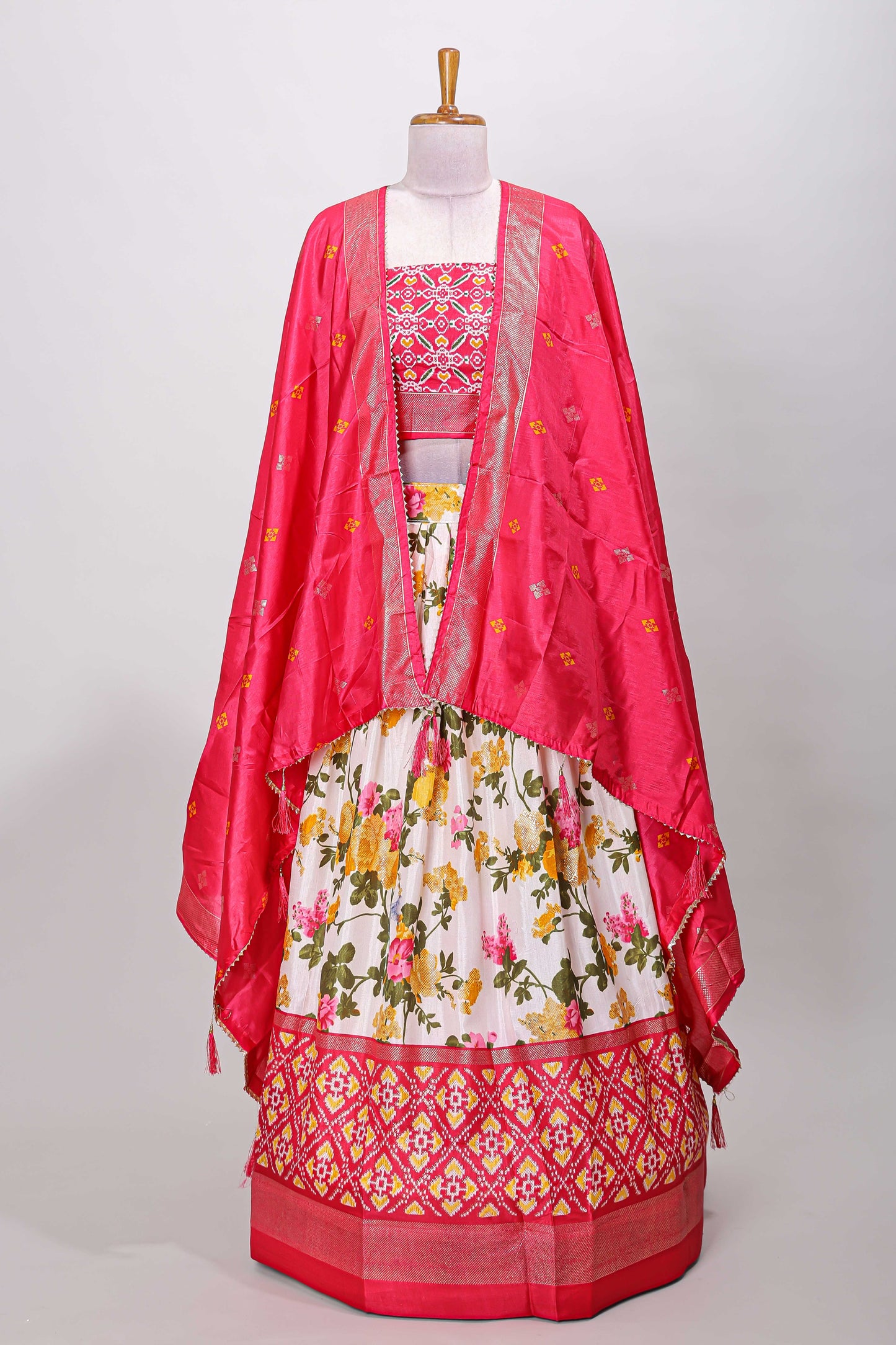White dola silk floral lehenga with pink pochampalli border and floral butta dhavani