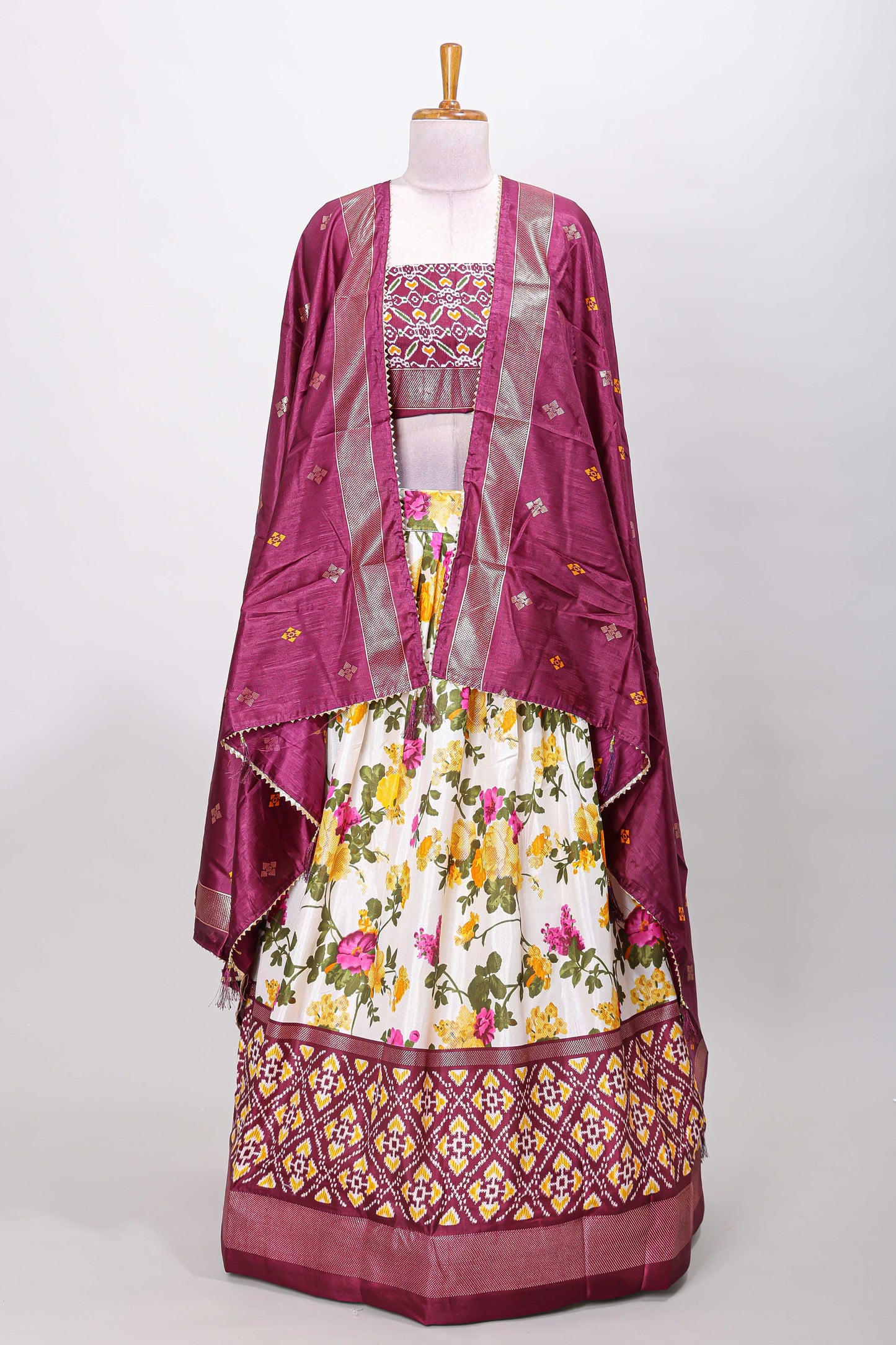 White dola silk floral lehenga with purple pochampalli border and floral butta dhavani