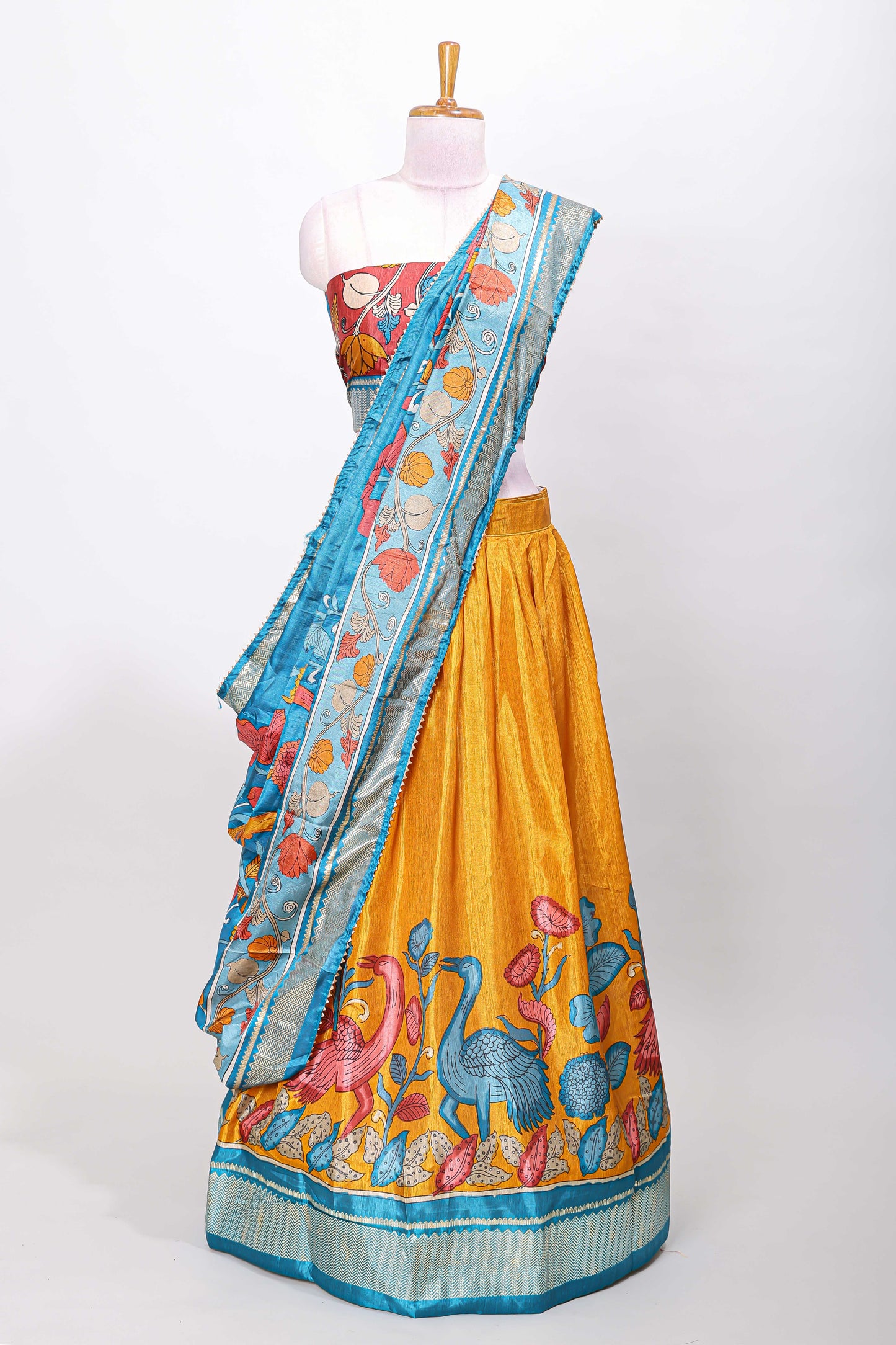 Mustard dola silk birds and floral printed lehenga with contrast blouse and dhavani