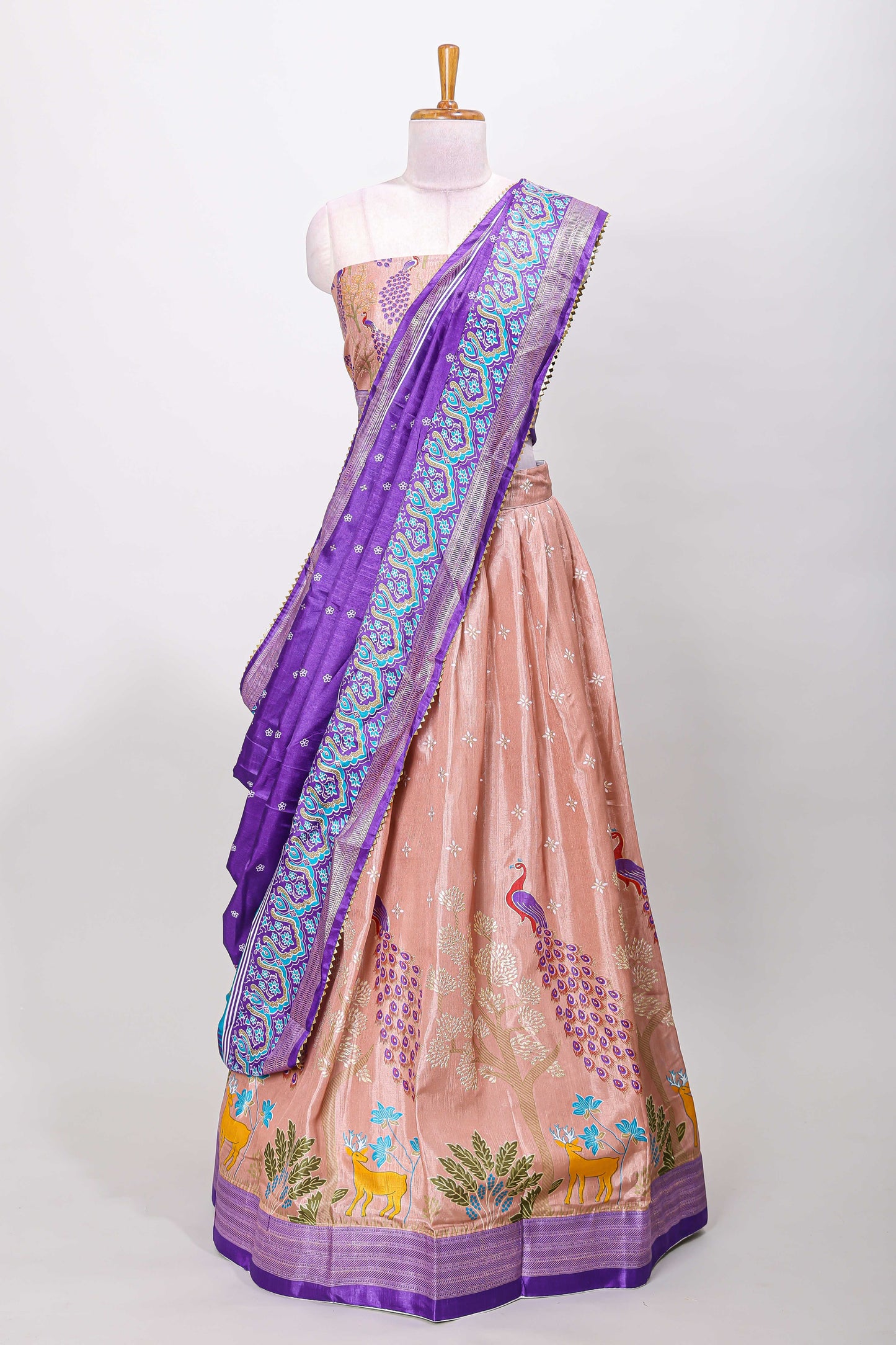Peach dola silk peacock and floral printed lehenga with contrast border and dhavani