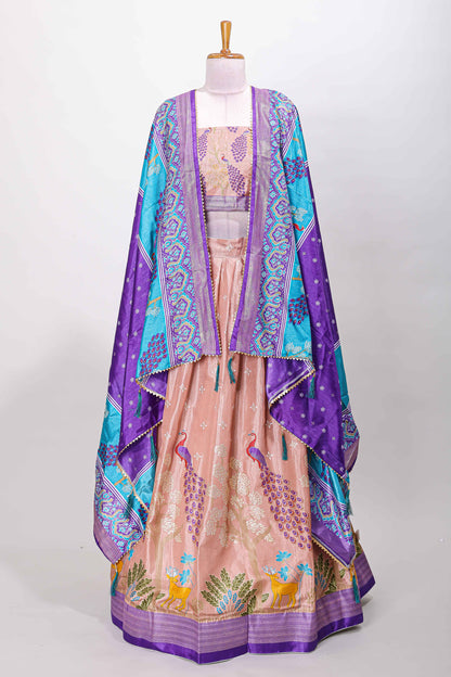 Peach dola silk peacock and floral printed lehenga with contrast border and dhavani