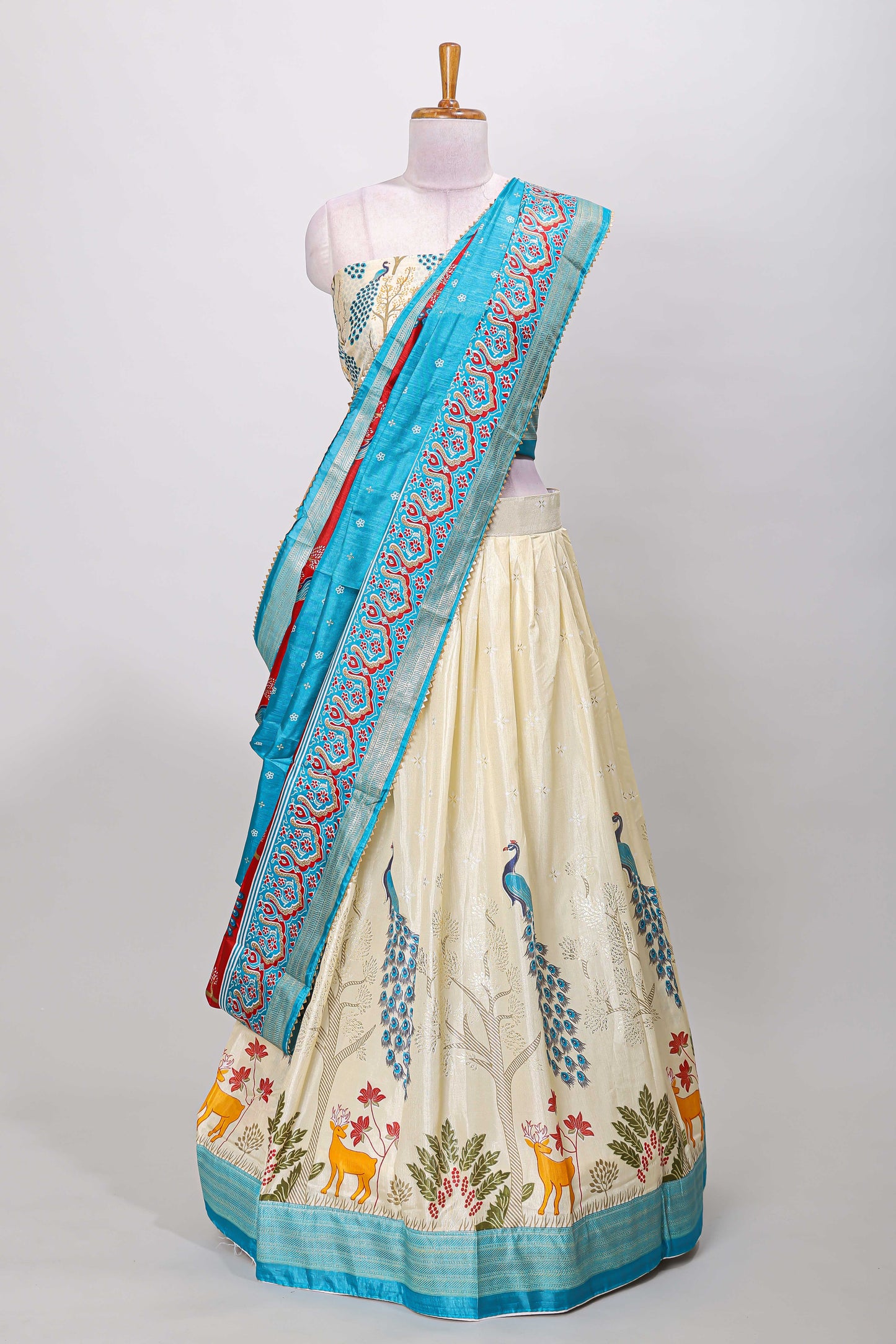 Cream dola silk peacock and floral printed lehenga with contrast border and dhavani