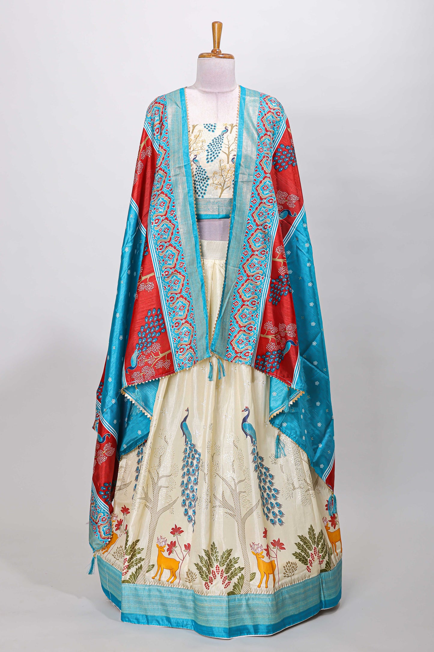 Cream dola silk peacock and floral printed lehenga with contrast border and dhavani