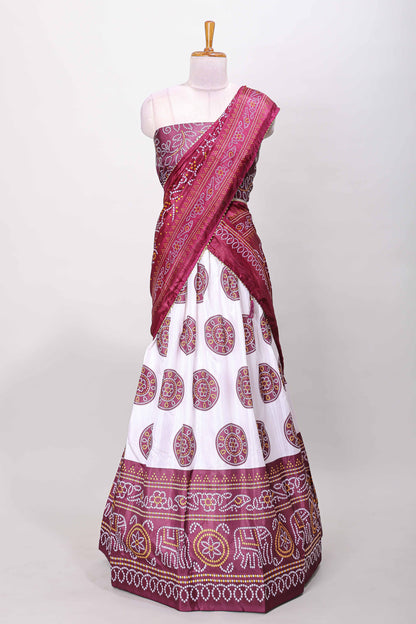 Maroon dola silk bhandani elephant and floral printed lehenga with contrast blouse and dhavani