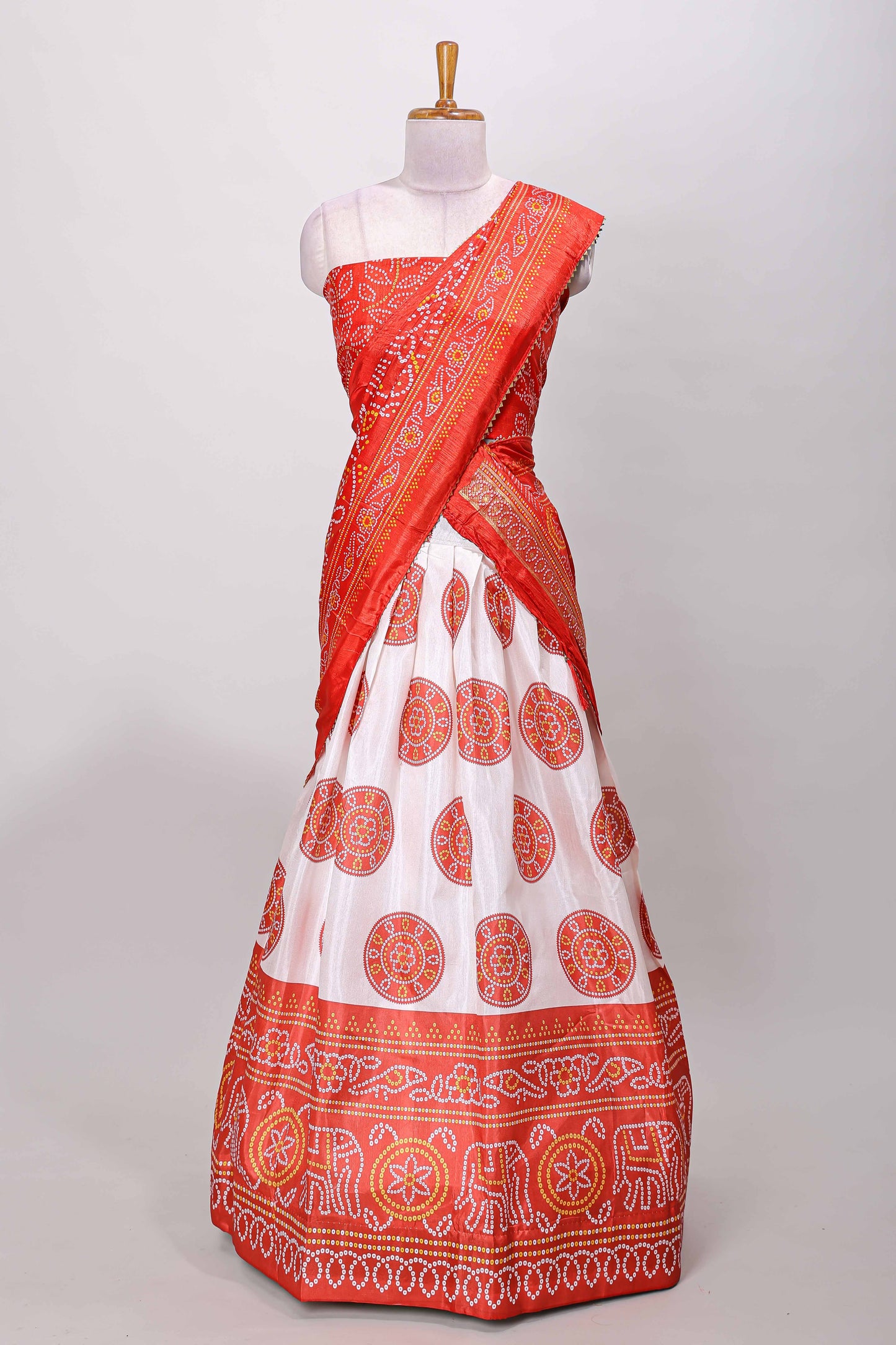Red dola silk bhandani elephant and floral printed lehenga with contrast blouse and dhavani