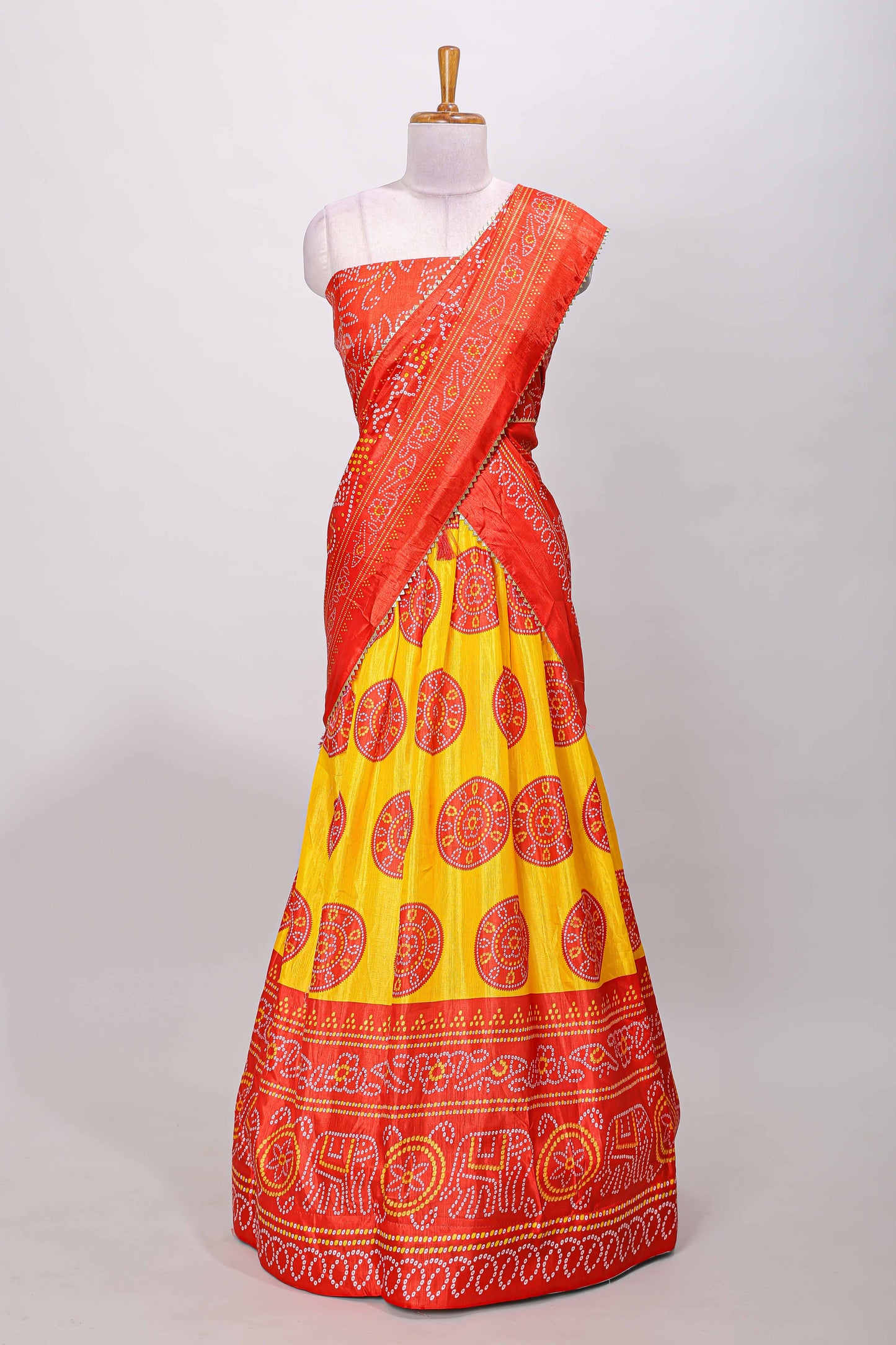 Yellow dola silk bhandani elephant and floral printed lehenga with contrast blouse and dhavani