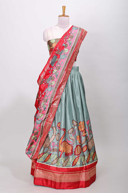 Turquoise blue dola silk birds and floral printed lehenga with contrast blouse and dhavani