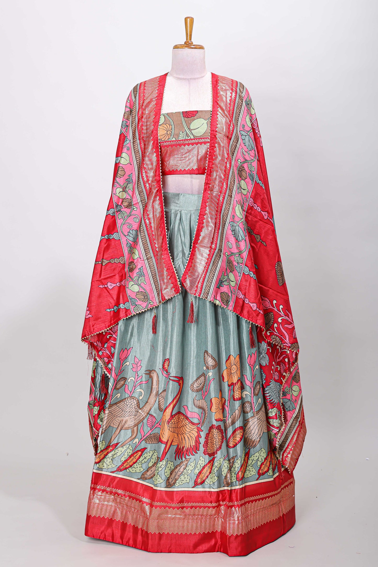 Turquoise blue dola silk birds and floral printed lehenga with contrast blouse and dhavani