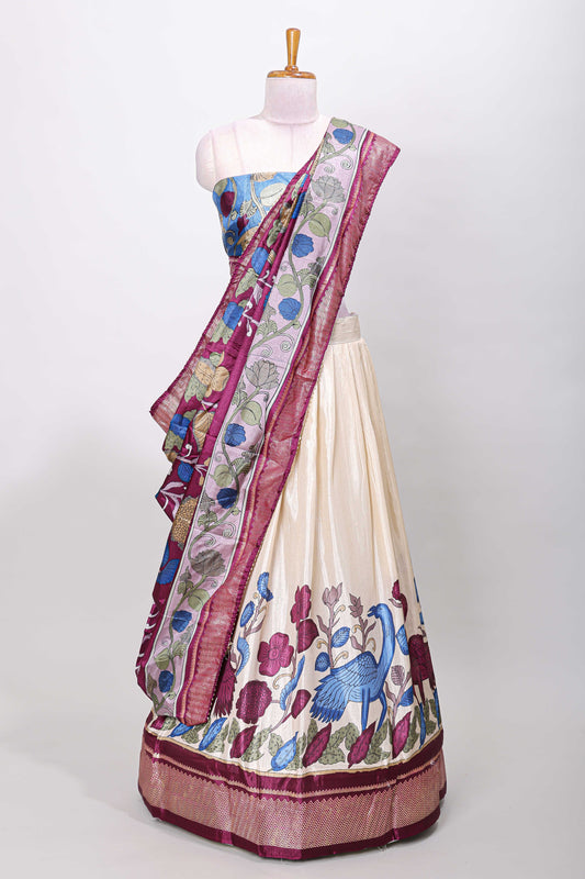 Cream dola silk birds and floral printed lehenga with contrast blouse and dhavani