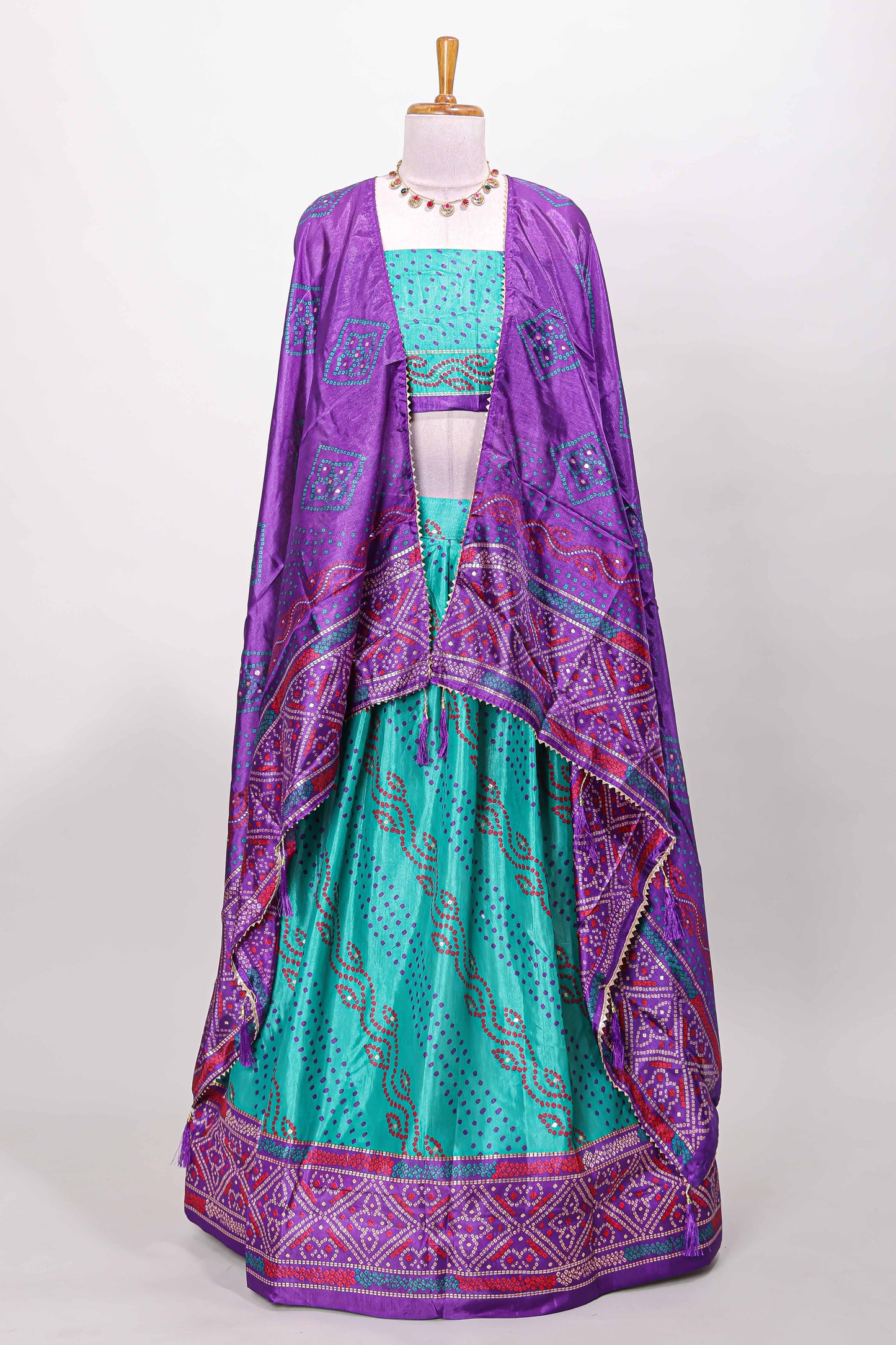 Peacock green dola silk bandhani dotted stripe lehenga set with contrast dhavani