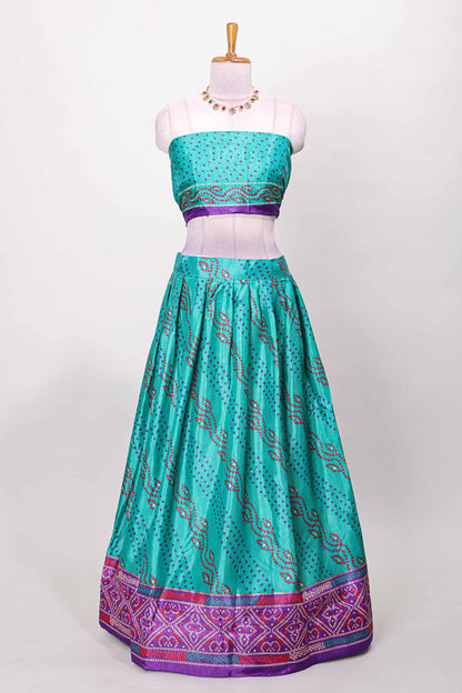 Peacock green dola silk bandhani dotted stripe lehenga set with contrast dhavani