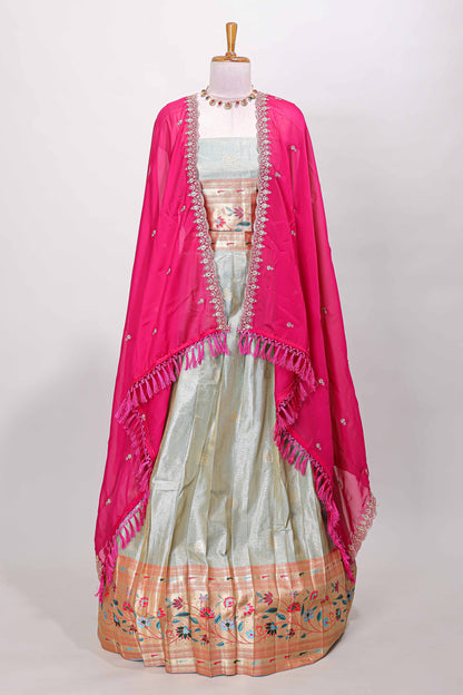 Blue tissue lehenga with floral vines butta design and contrast border dhavani