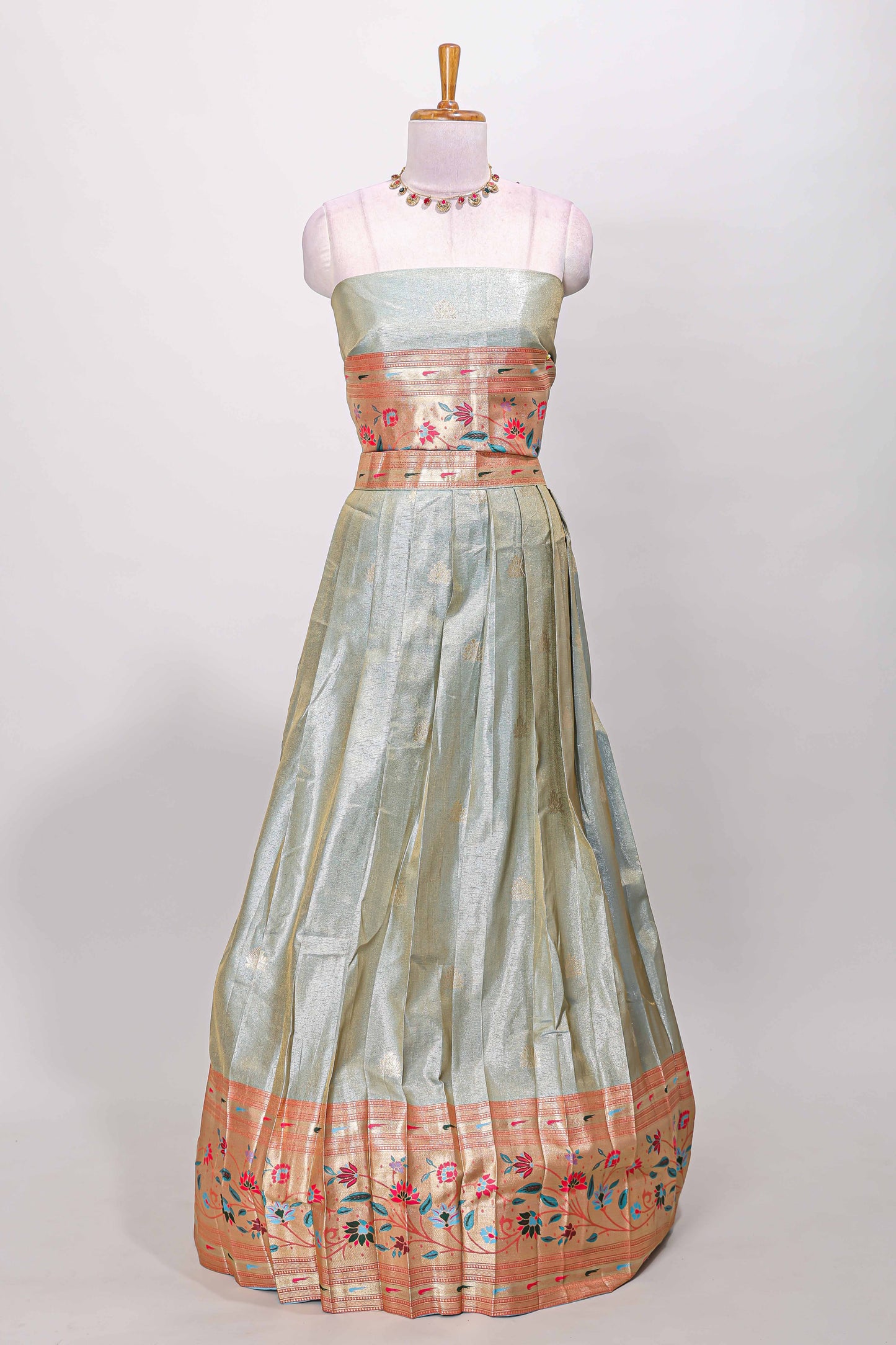 Blue tissue lehenga with floral vines butta design and contrast border dhavani