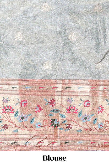 Blue tissue lehenga with floral vines butta design and contrast border dhavani