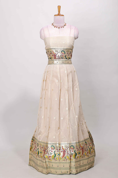 Cream cotton lehenga with floral vines zari butta design and green border dhavani