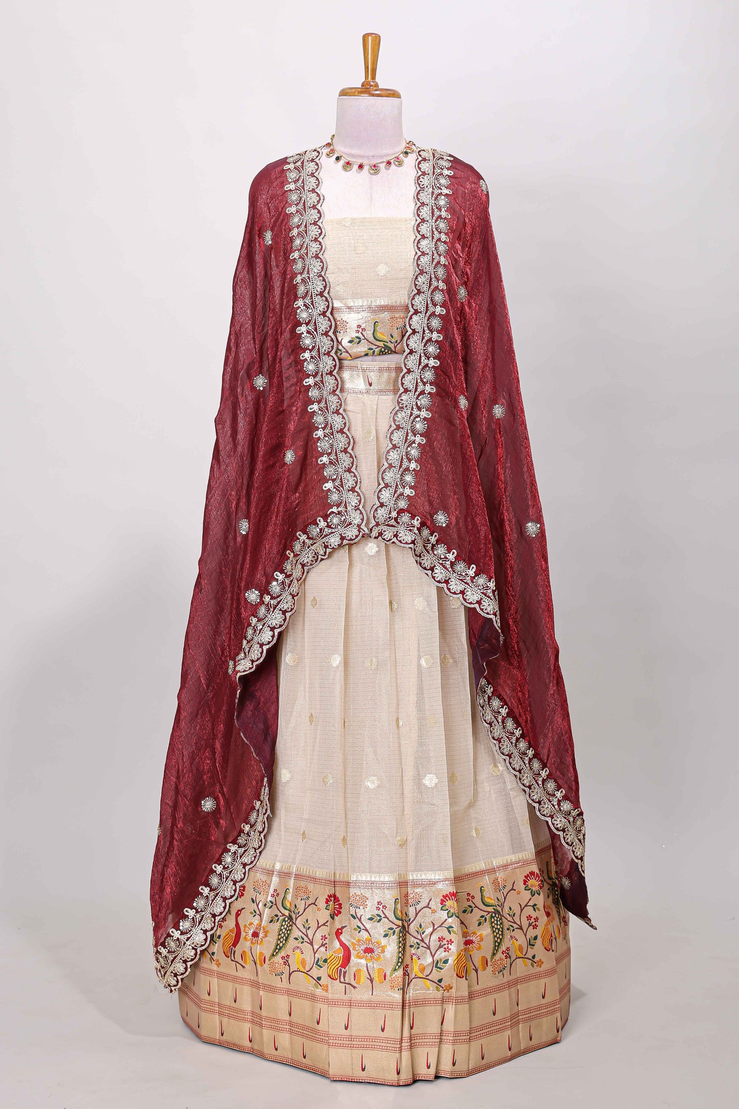 Cream cotton lehenga with floral vines zari butta design and maroon border dhavani