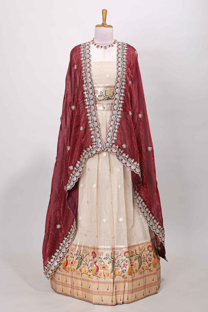 Cream cotton lehenga with floral vines zari butta design and maroon border dhavani
