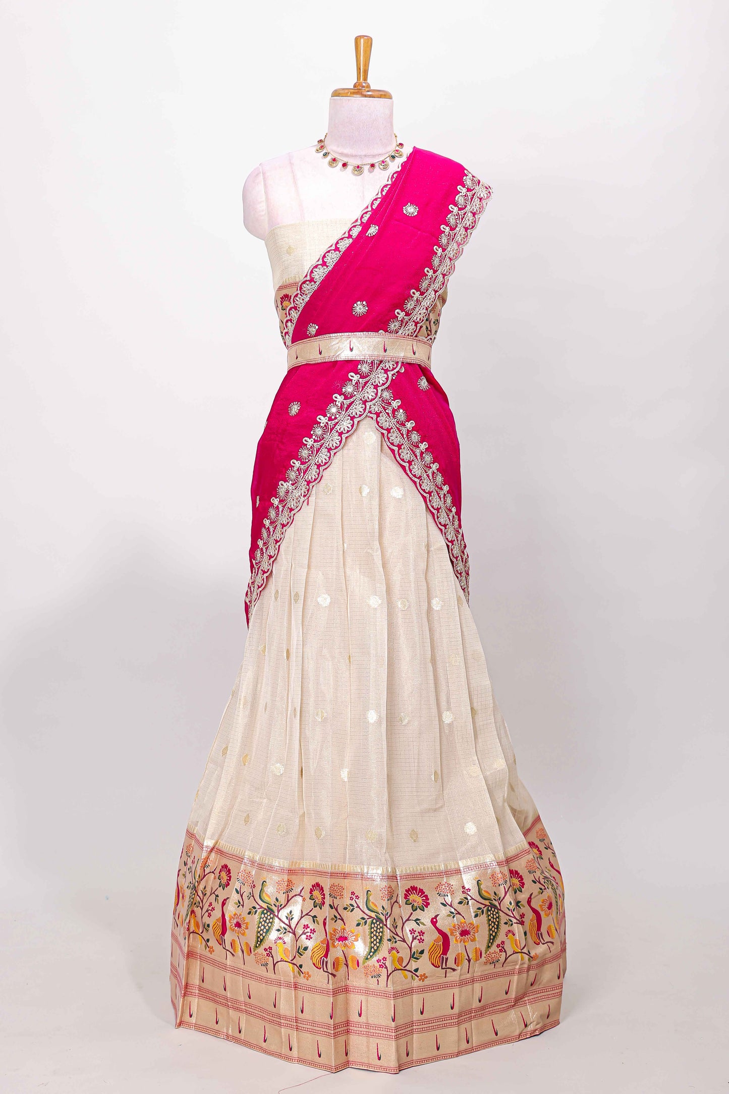 Cream cotton lehenga with floral vines zari butta design and pink border dhavani