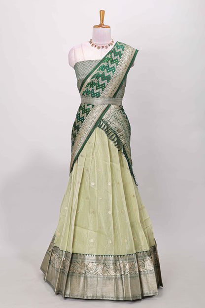 Green kota cotton lehenga featuring a textured body with zari butta, finished with a contrast border and matching dhavani
