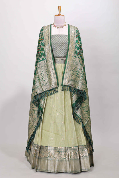 Green kota cotton lehenga featuring a textured body with zari butta, finished with a contrast border and matching dhavani