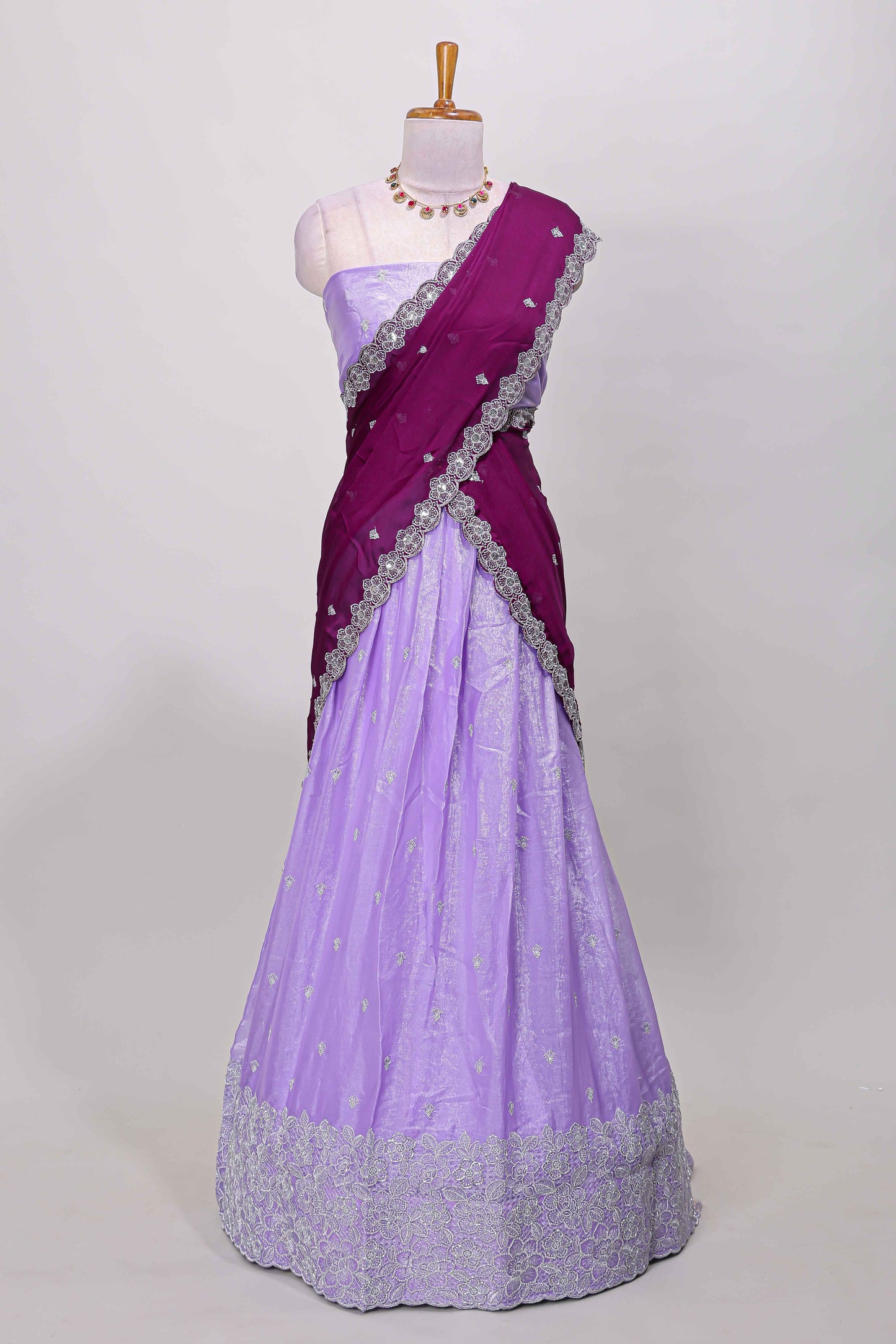 Lavender fendy chiffon lehenga with all over embroidery and stone work, paired with a contrast dhavani