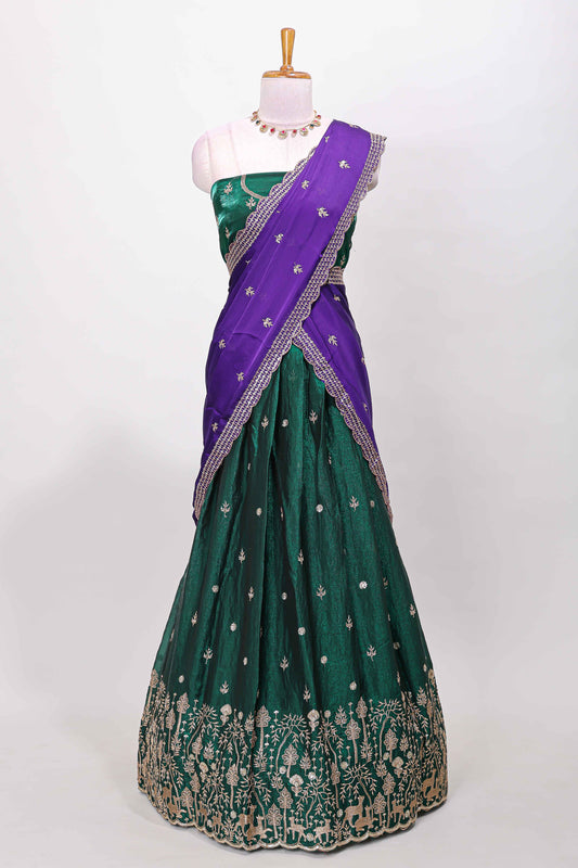 Green fendy chiffon lehenga with all over embroidery and stone work, paired with a contrast dhavani