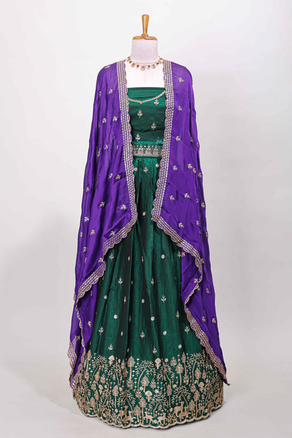 Green fendy chiffon lehenga with all over embroidery and stone work, paired with a contrast dhavani