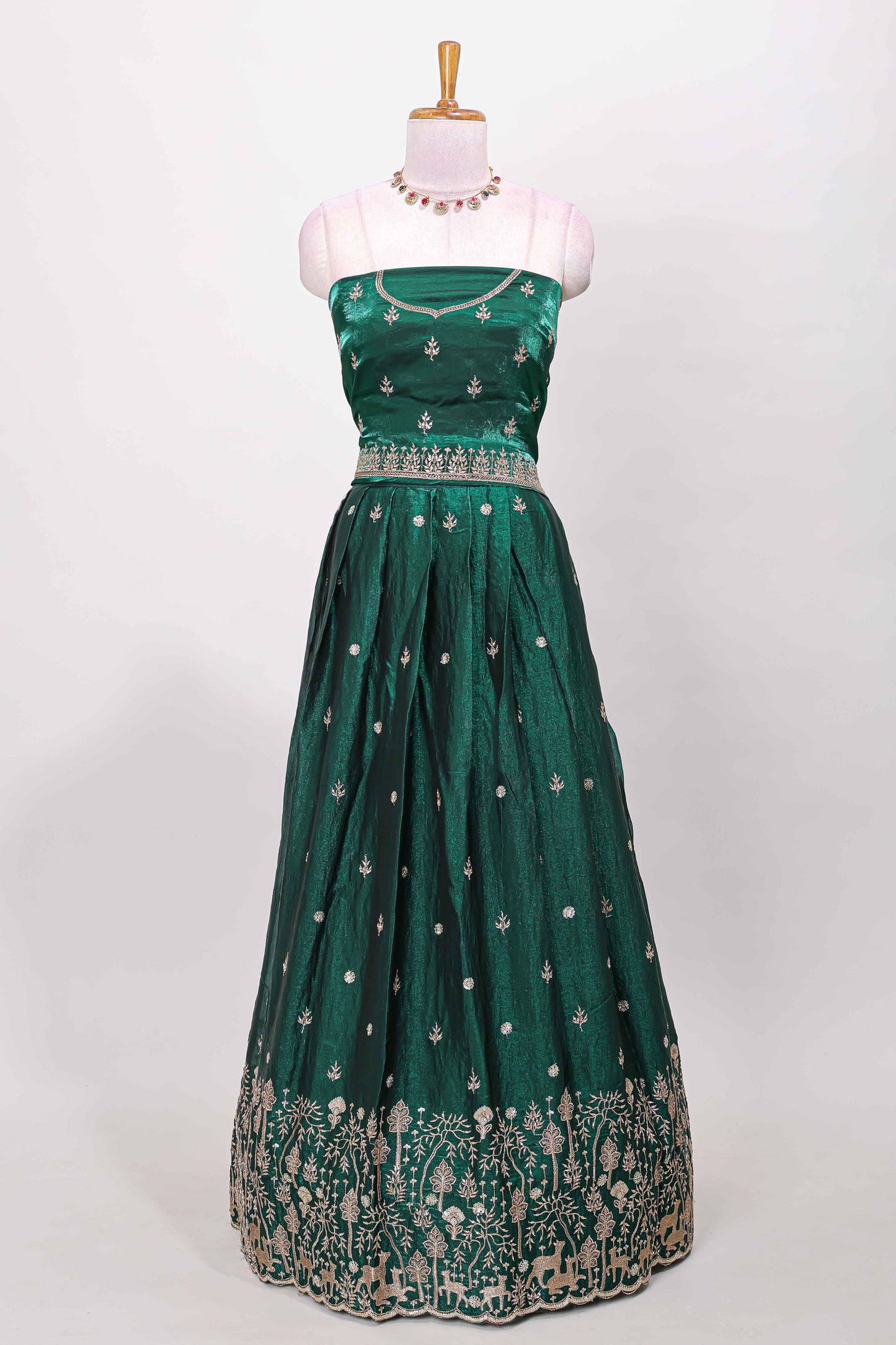 Green fendy chiffon lehenga with all over embroidery and stone work, paired with a contrast dhavani