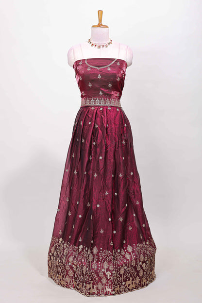 Maroon fendy chiffon lehenga with all over embroidery and stone work, paired with a contrast dhavani