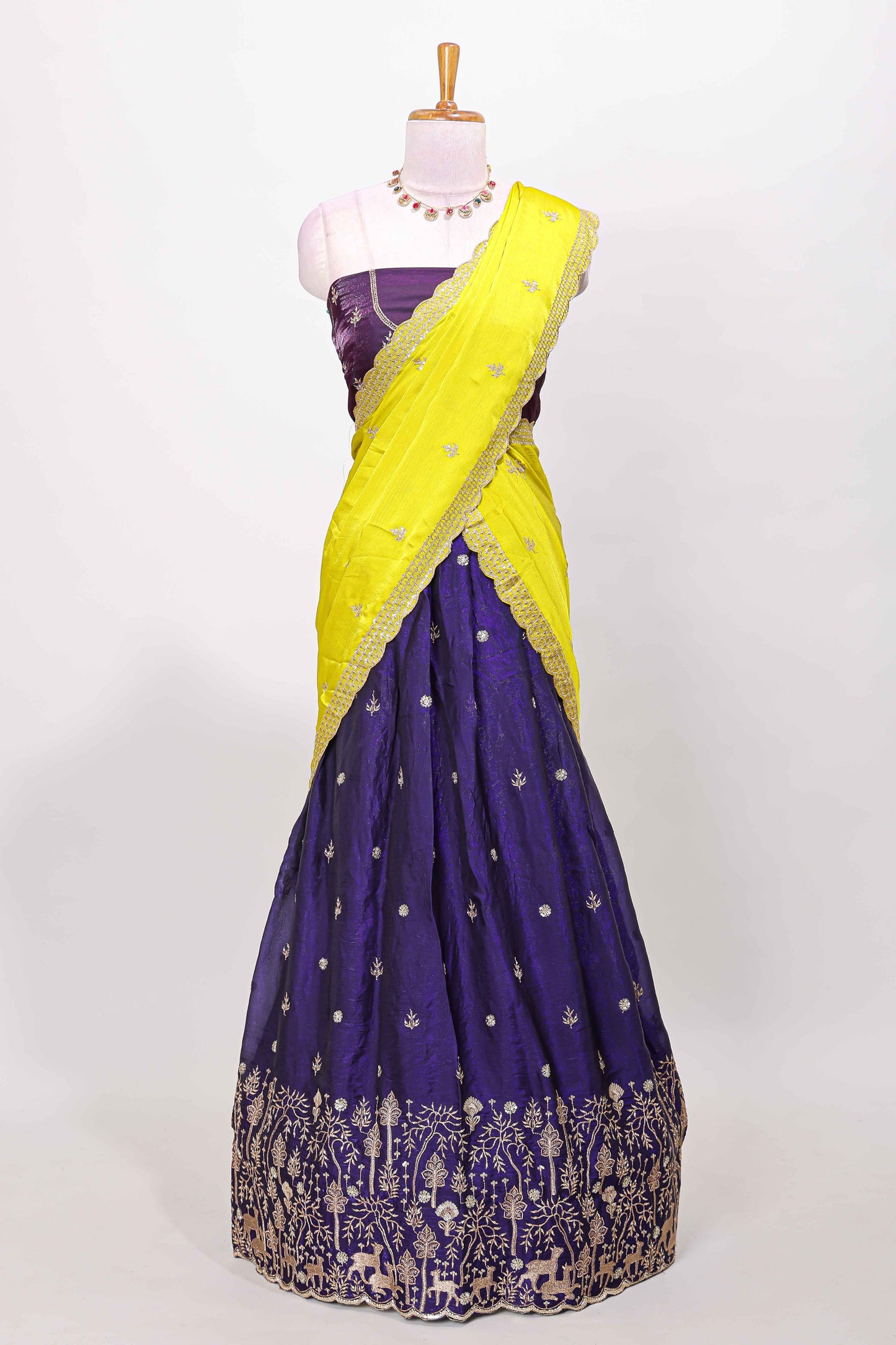 Violet fendy chiffon lehenga with all over embroidery and stone work, paired with a contrast dhavani
