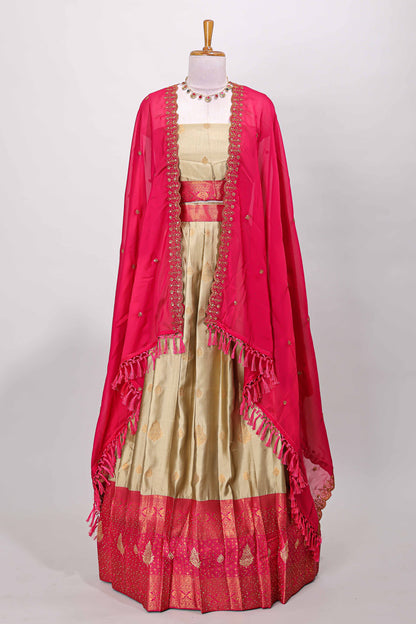 Golden raw silk zari butta lehenga with pink contrast border and dhavani