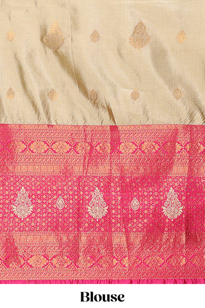 Golden raw silk zari butta lehenga with pink contrast border and dhavani