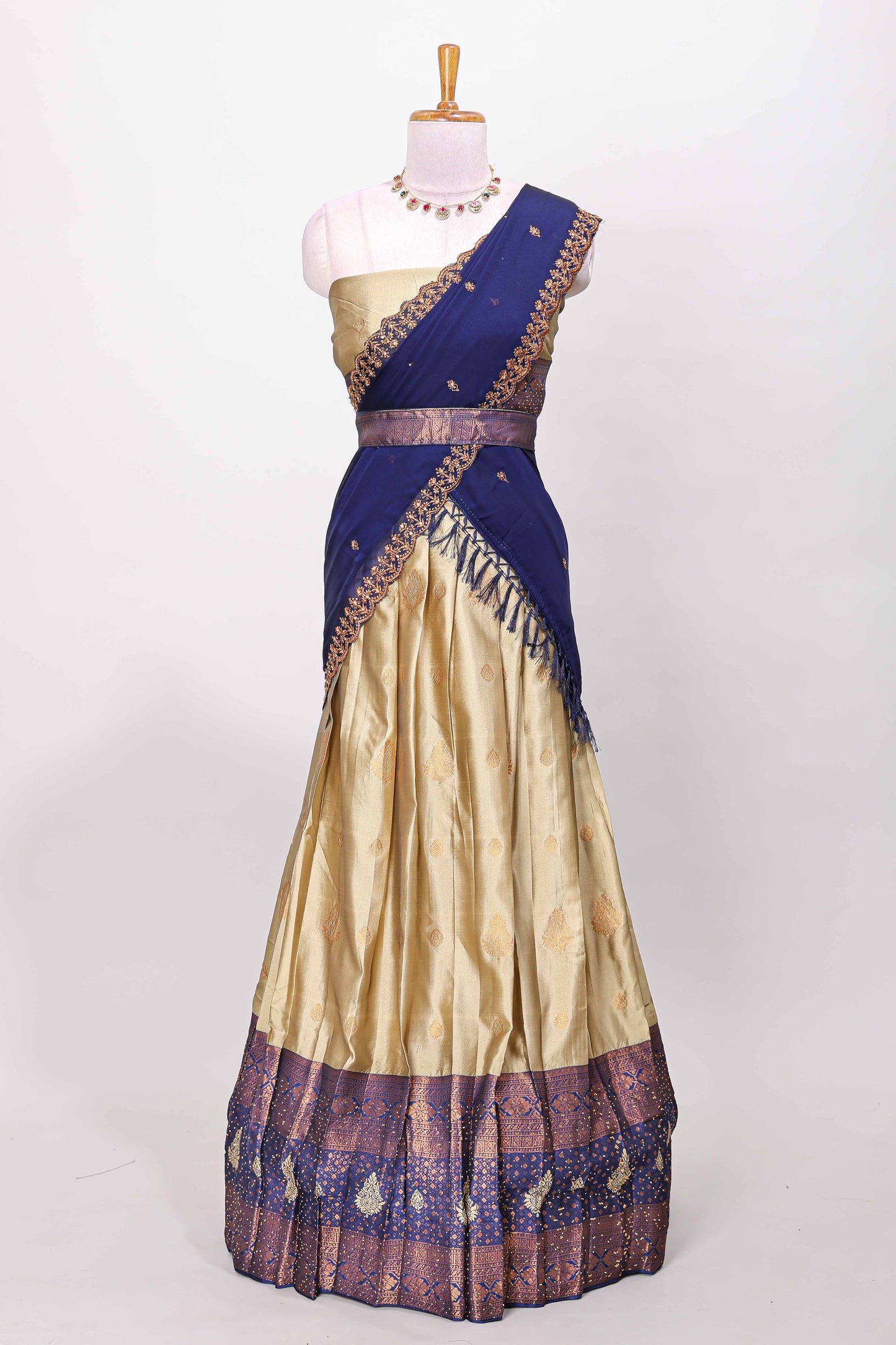 Golden raw silk zari butta lehenga with blue contrast border and dhavani