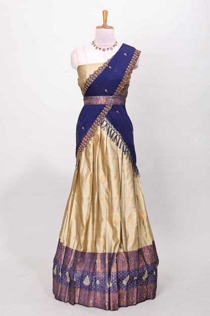 Golden raw silk zari butta lehenga with blue contrast border and dhavani
