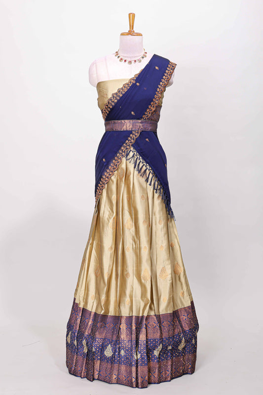 Golden raw silk zari butta lehenga with blue contrast border and dhavani