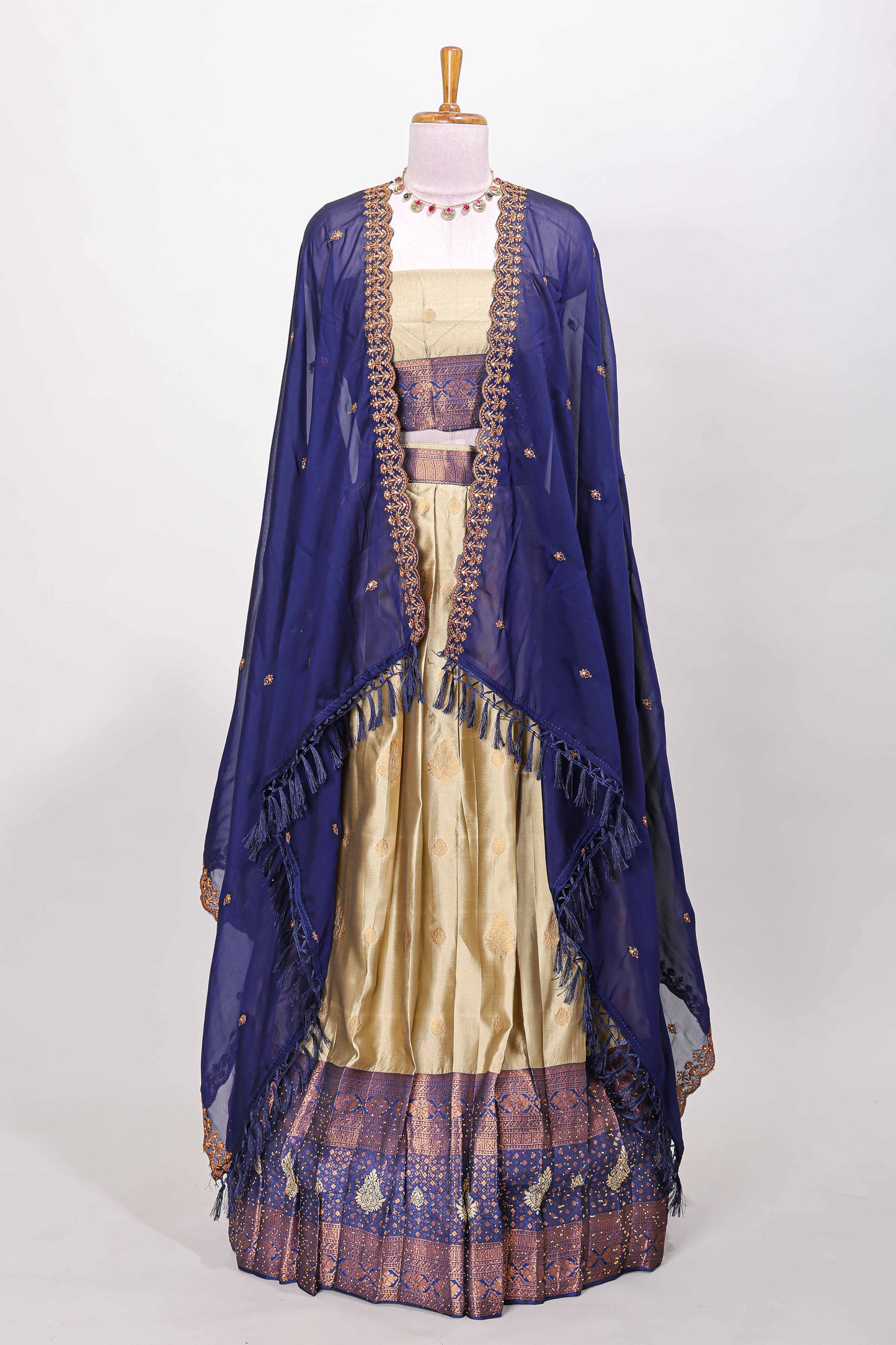 Golden raw silk zari butta lehenga with blue contrast border and dhavani