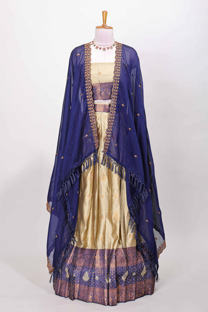 Golden raw silk zari butta lehenga with blue contrast border and dhavani
