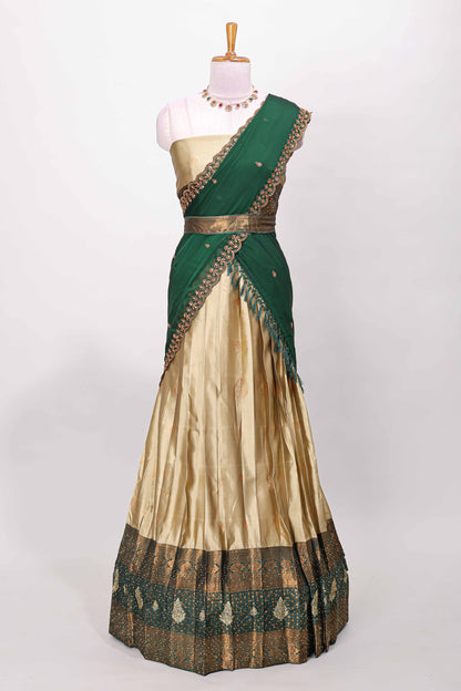 Golden raw silk zari butta lehenga with green contrast border and dhavani