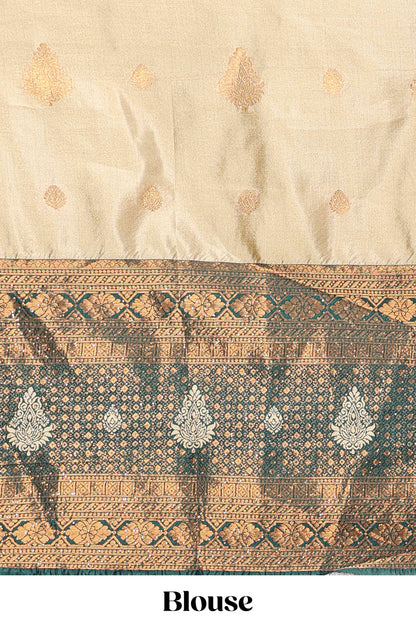 Golden raw silk zari butta lehenga with green contrast border and dhavani