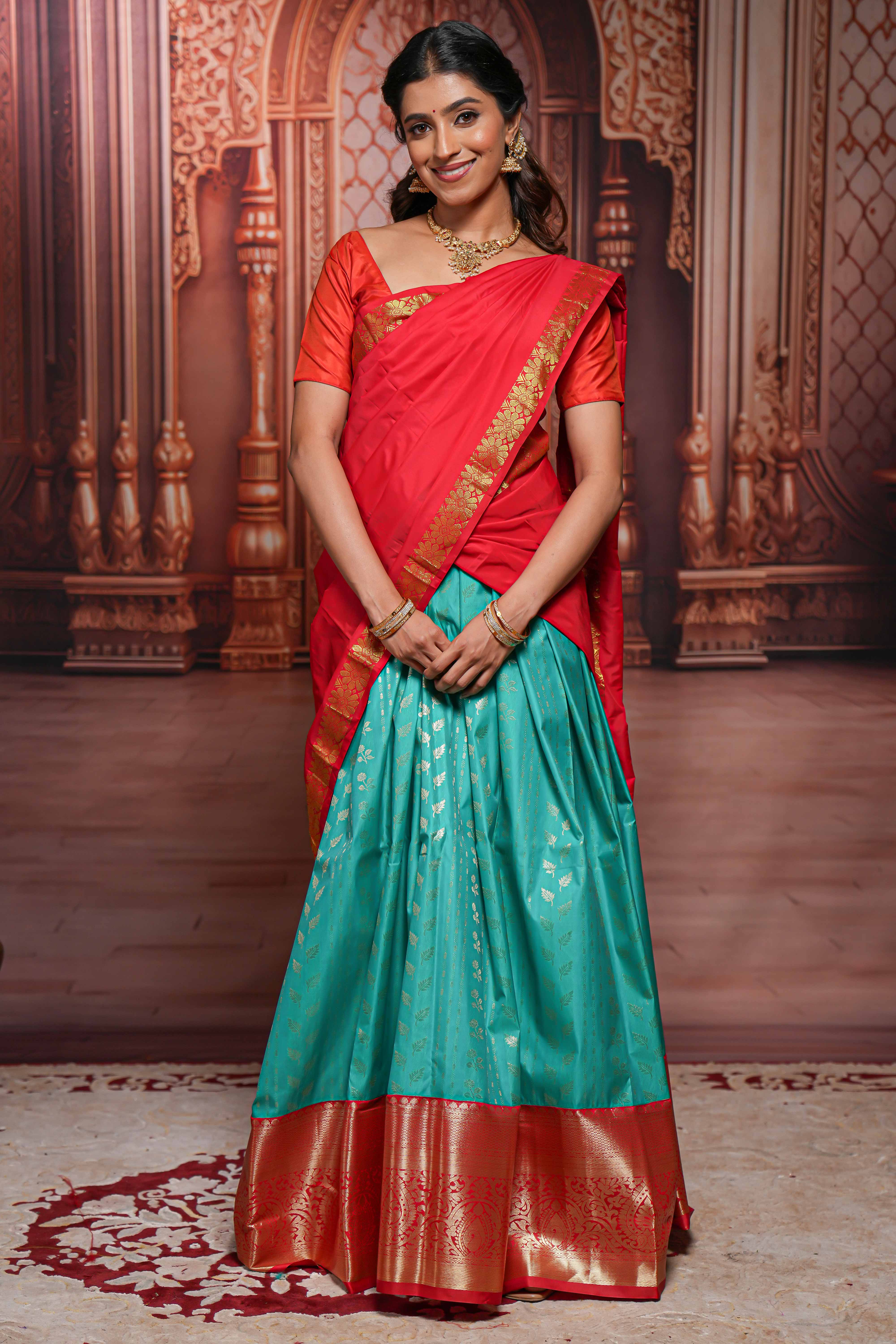 Turquoise blue floral zari design half saree with contrast zari border and dhavani