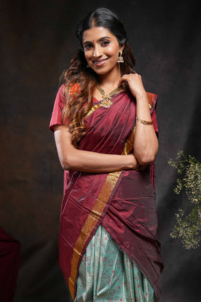 Turquoise green jacquard floral zari design half saree with contrast zari border and dhavani