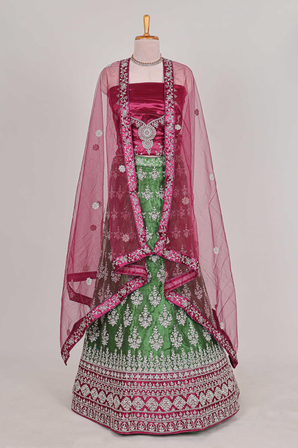 Beautiful net lehenga with intricate embroidery stone work and contrast border paired with a contrast net shawl