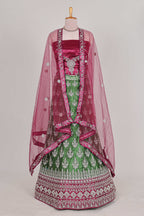 Beautiful net lehenga with intricate embroidery stone work and contrast border paired with a contrast net shawl