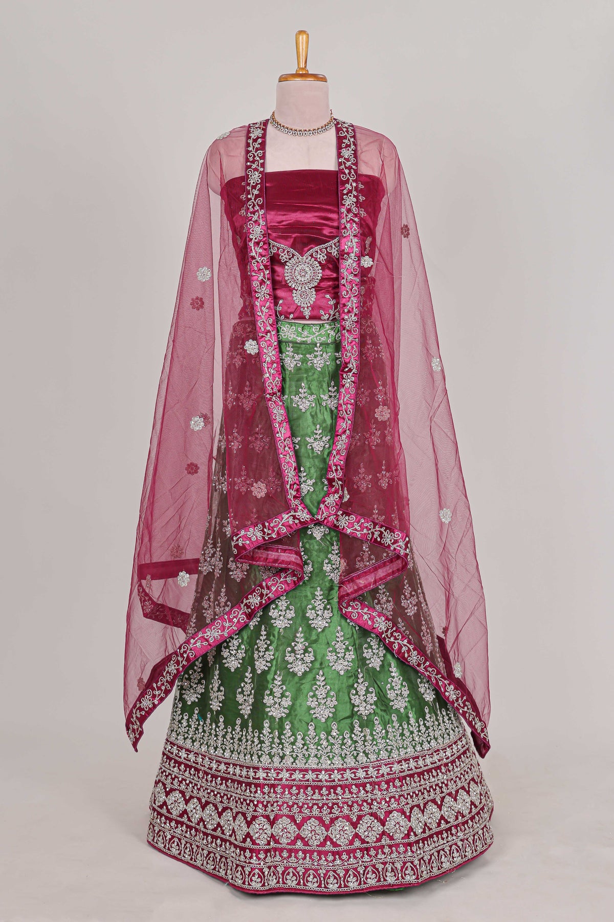Beautiful net lehenga with intricate embroidery stone work and contrast border paired with a contrast net shawl