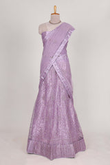 Lavender net lehenga featuring delicate embroidery with a borderless design paired with a matching self shawl
