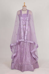 Lavender net lehenga featuring delicate embroidery with a borderless design paired with a matching self shawl