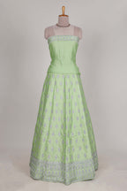 Powder green satin lehenga featuring delicate embroidery with a bordered design paired with a matching self shawl